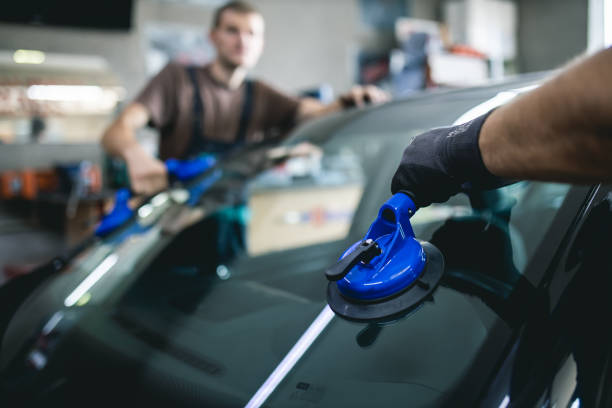 istock Replacement of car glass in a car service. 1411682198