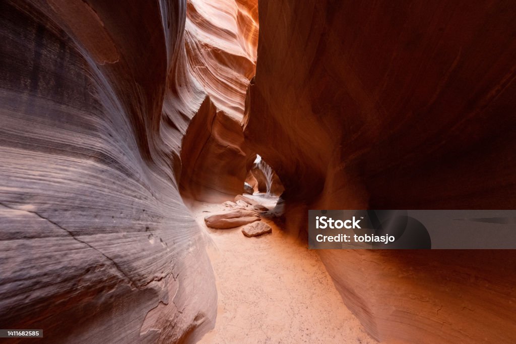 Antelope Canyon View along a hike inside the deep and narrow Antelope Canyon. This slot canyon is located near the city of Page in Arizona, USA. The walls are shaped like waves. Grand Canyon Stock Photo