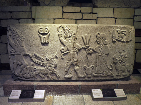 Ankara, Türkiye - July 2021: Scene of offering drink and sacrifice. 1200 - 700 BC.\nHittite and late Hittite products from Aslantepe-Malatya disctrict in\nAnatolian Civilizations Museum.