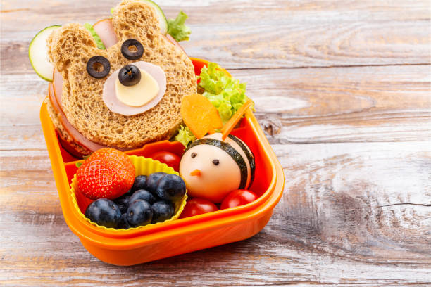 istock Lunch box with funny bear sandwich 1411689314
