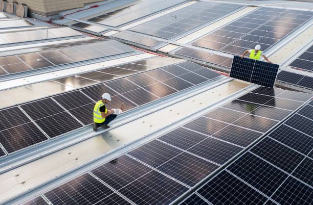 istock Installation process of solar panels on a roof. 1411689731
