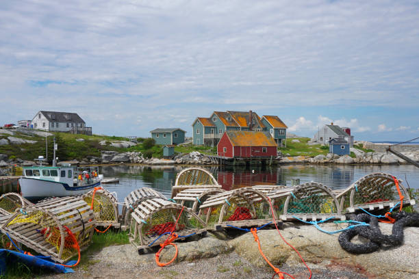 Lobster traps on the shore of Peggys Cove Nova Scotia stock photo