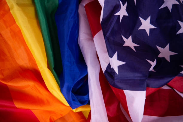 istock Equality. American and gay flag side by side. 1411692828