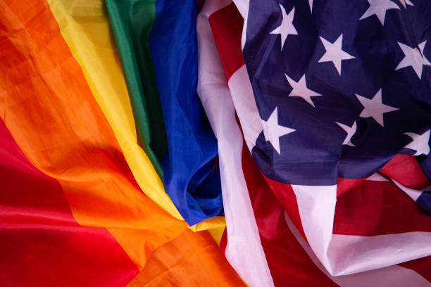 istock Equality. American and gay flag side by side. 1411693141