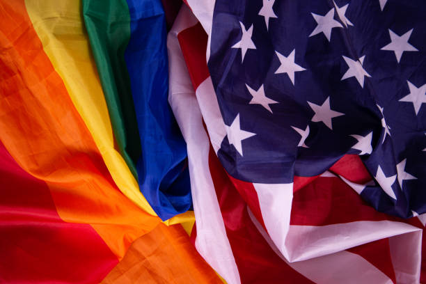 istock Equality. American and gay flag side by side. 1411694113