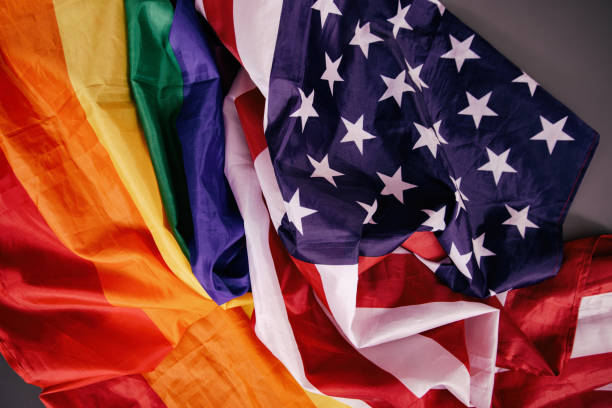 istock Equality. American and gay flag side by side. 1411694437