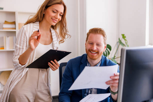 istock Colleagues working together in an office 1411696923