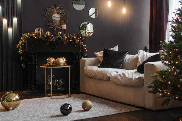 istock Christmas interior with a beautiful Christmas tree, sofa, light bulbs and dark background. 1411696999