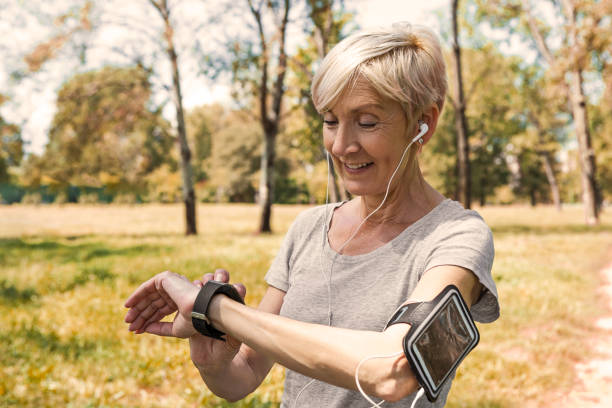 istock Senior woman checking the pulse 1411697247