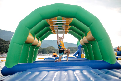 Boy enjoying in Water Park competing
