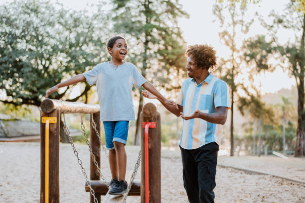 istock Father and son on the playground 1411698047