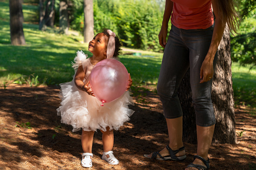 Baby Girl and Her Mother At Park in Summer