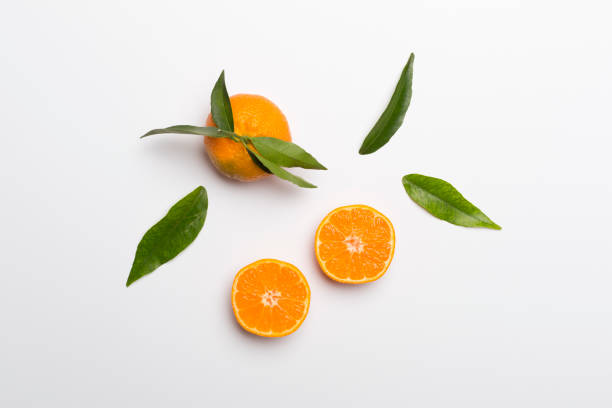 istock Flat lay with fresh mandarines on color background. Top view 1411699362