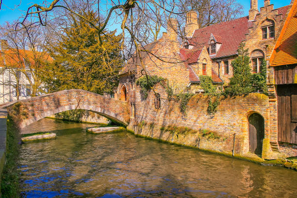 istock Peaceful Canal in idyllic Bruges with bridge, Belgium 1411701745