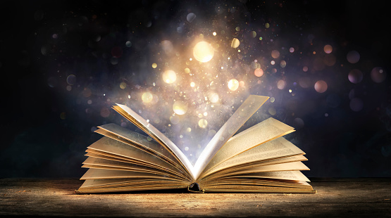 Magic Book With Glitter - Open Book With Lights Glowing In Dark Background