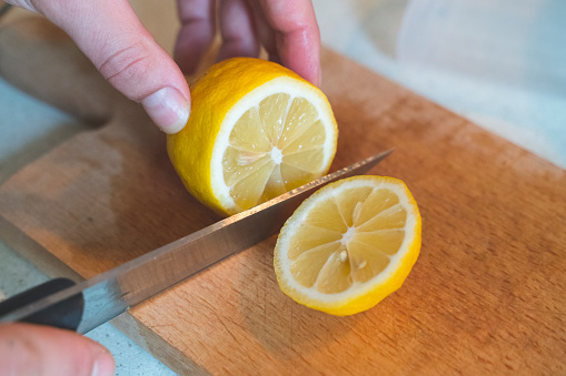 Chopping a lemon for dinner