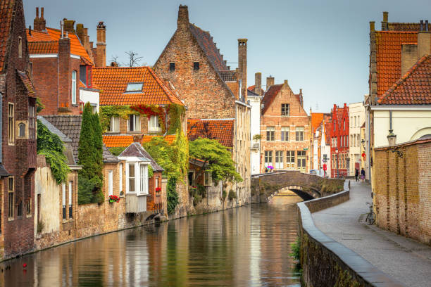 istock Peaceful Canal in idyllic Bruges with bridge, Belgium 1411702086