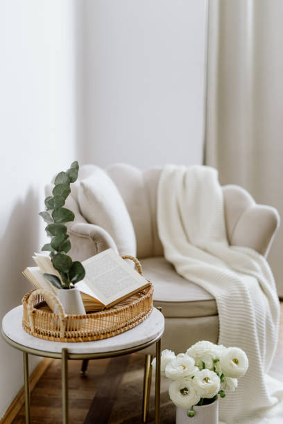 istock Home decor on coffee table, against classic armchair 1411702919