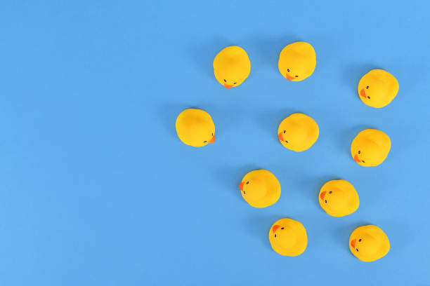 istock Top view of many yellow rubber ducks 1411710888