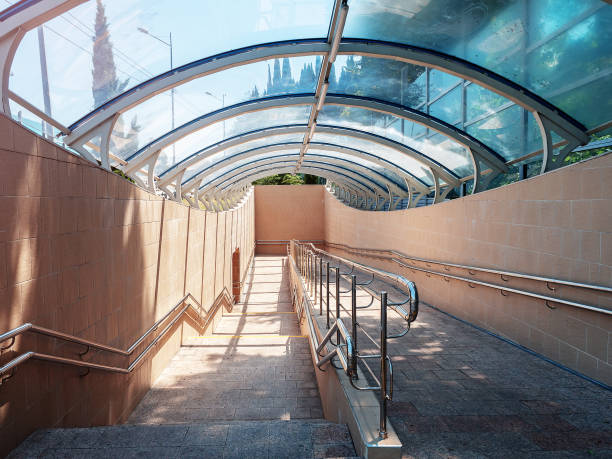 istock Descent to the underground passage. Glass dome canopy. Modern urban architecture 1411712137