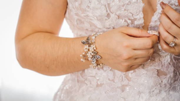 istock bride puts on a white wedding dress 1411712756