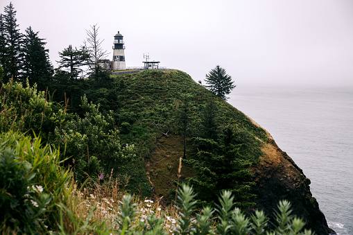 A view of the Cape Disappointment Lighthouse overlooking the Pacific Ocean in Washington state, USA.