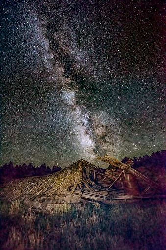 Old ruined farm building under the stars in rural  Oregon