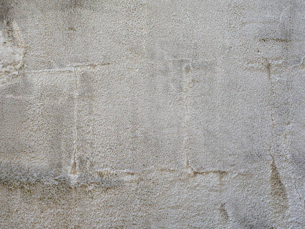 istock Gray textured stucco. Rough plastered gray wall. Full screen photo. Not seamless texture 1411718920