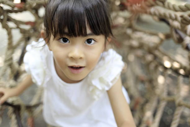 A lovely asian woman in a park’ grassplot.A lovely asian woman in a park.