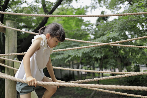 Japanese student girl playing with rope walking (7 years old)