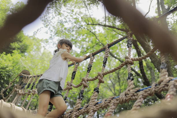 istock Japanese student girl playing with rope walking (7 years old) 1411719635