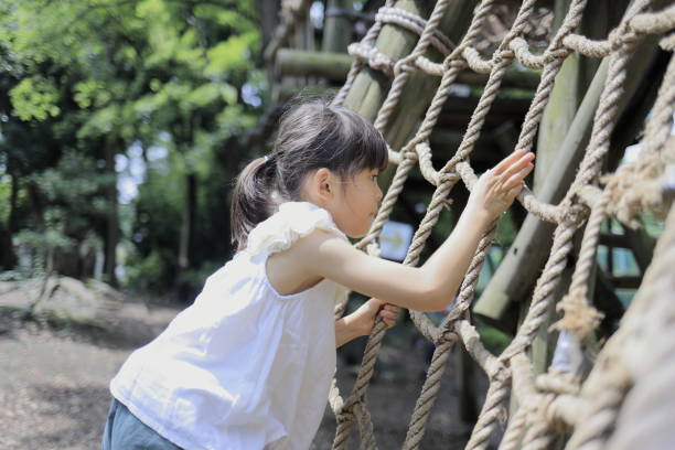 istock Japanese student girl playing with rope walking (7 years old) 1411719644