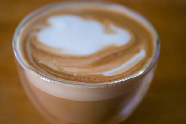 Flat White Coffee against wooden background