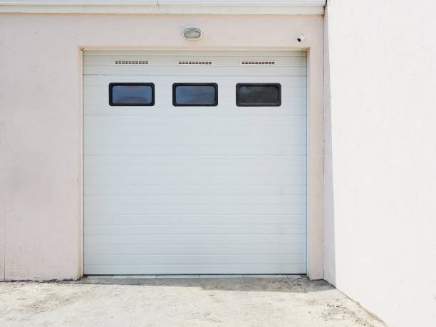 istock Garage with automatic gates in a private house. View outside. Protected property. 1411722330