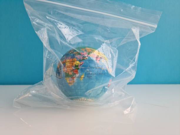 istock Globe world in a plastic bag. Earth Day and World Environment Day. 1411727537