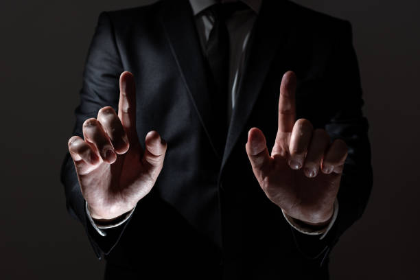 istock Businessman Pointing With Two Fingers On Important Messages. Executive In Suit Presenting Crutial Informations. Gentleman Showing Critical Announcement. 1411727678