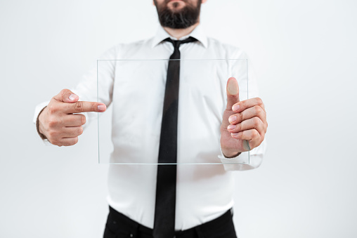 Businessman Pointing At Glass And Showing New Ideas To Achieve Goals.