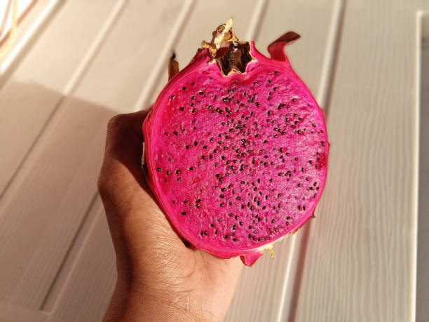 istock Person holding a red fruit dragon 1411735681