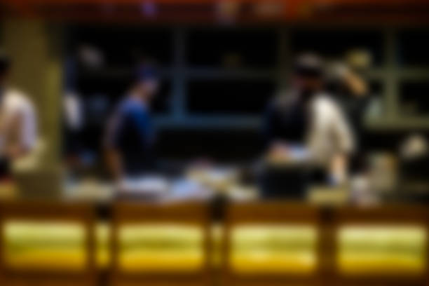 istock Blurred of chef in open kitchen in Japanese resterant 1411737931