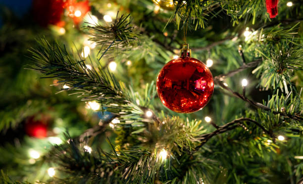 istock Christmas ornaments hanging on the tree 1411739310