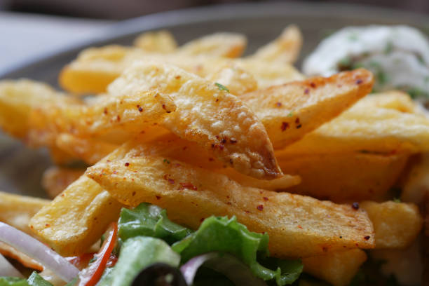 istock Tasty freshly made wage potato chips in a plate 1411740050