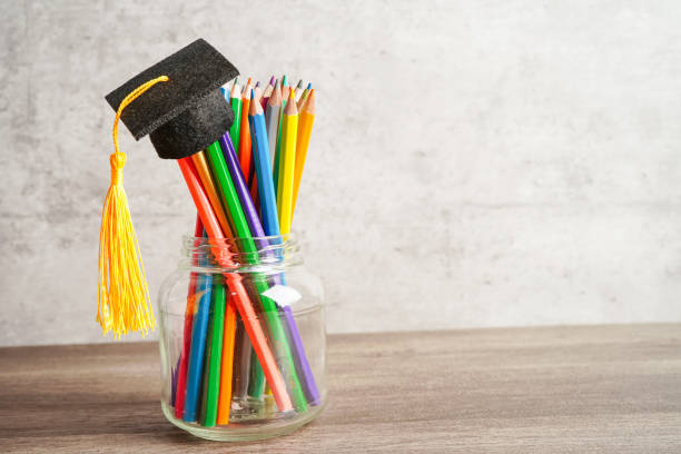 istock Colorful pencils in glass jar with copy space, learning university education concept. 1411744398