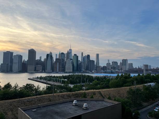 istock Manhattan view at sunset time at New York 1411746415