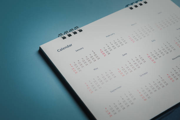 istock Embroidered red pins on a calendar event Planner calendar,clock to set timetable organize schedule,planning for business meeting or travel planning concept. 1411749920