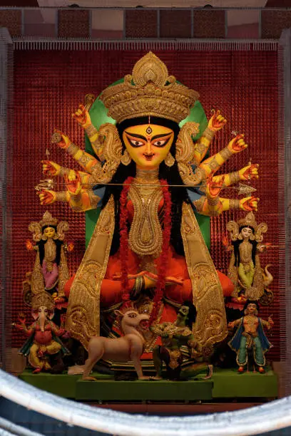 Goddess Durga devi idol decorated at puja pandal in Kolkata, West Bengal, India. Durga Puja is biggest religious festival of Hinduism and is now celebrated worldwide.