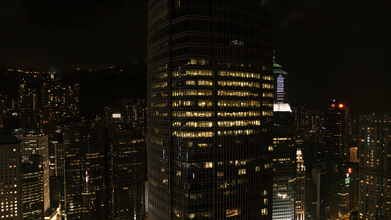 Aerial shot a Thousand of skyscraper on two side of Victoria Harbour of Hong Kong. View from the Peak at night