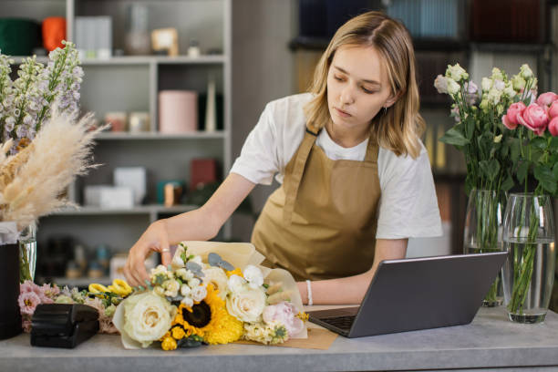 istock Florist woman using laptop. 1411755007
