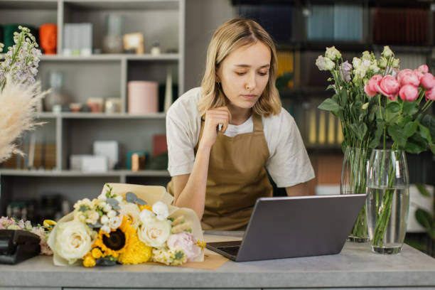 istock Florist woman using laptop. 1411755039