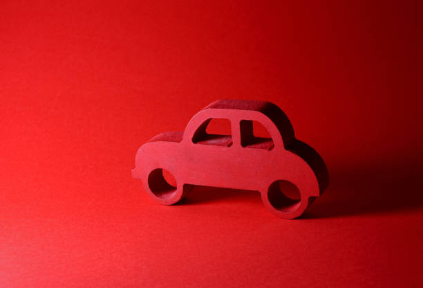 istock red wooden toy car on red background 1411757978