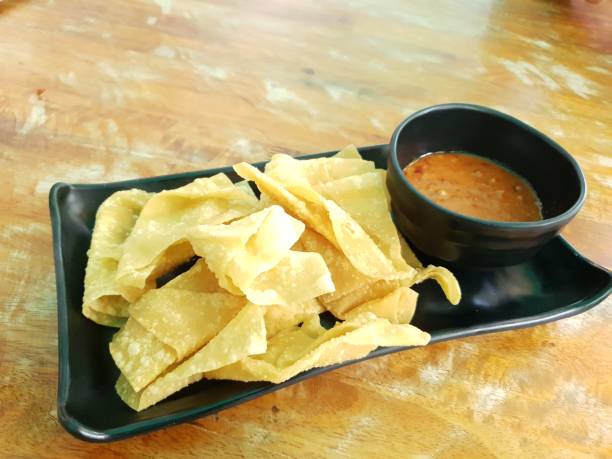 istock Fried dumplings served with sweet and sour sauce 1411758744